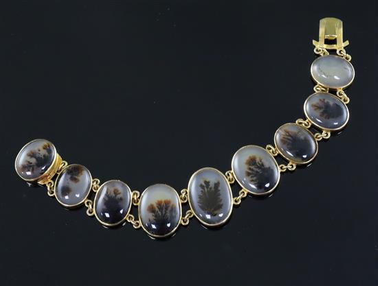 A late Victorian gold and moss agate bracelet, approximately 17cm.